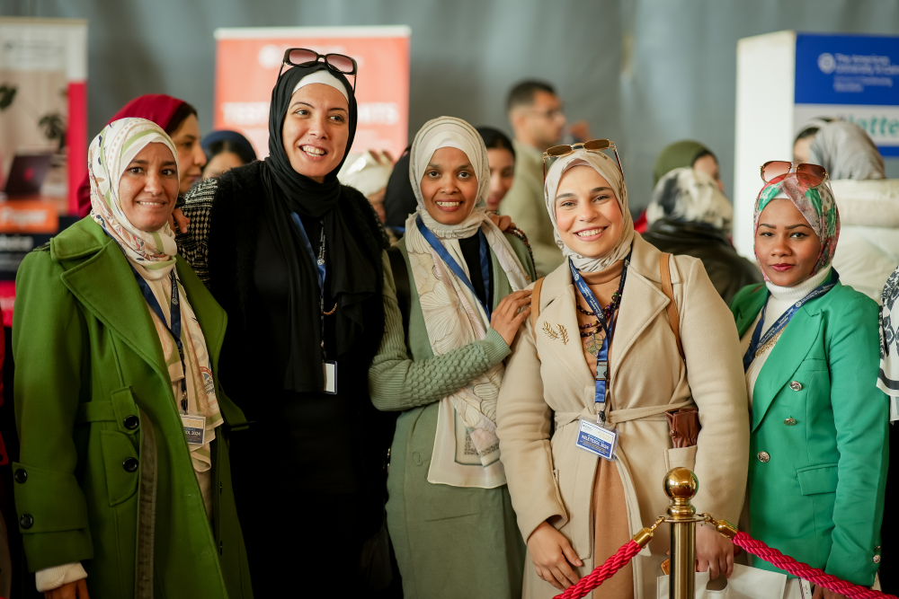 group of female teachers attending NileTESOL conference with conference tags