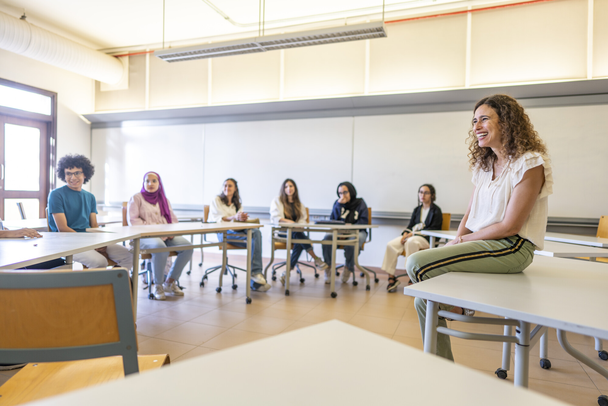 students in group in class talking in a group