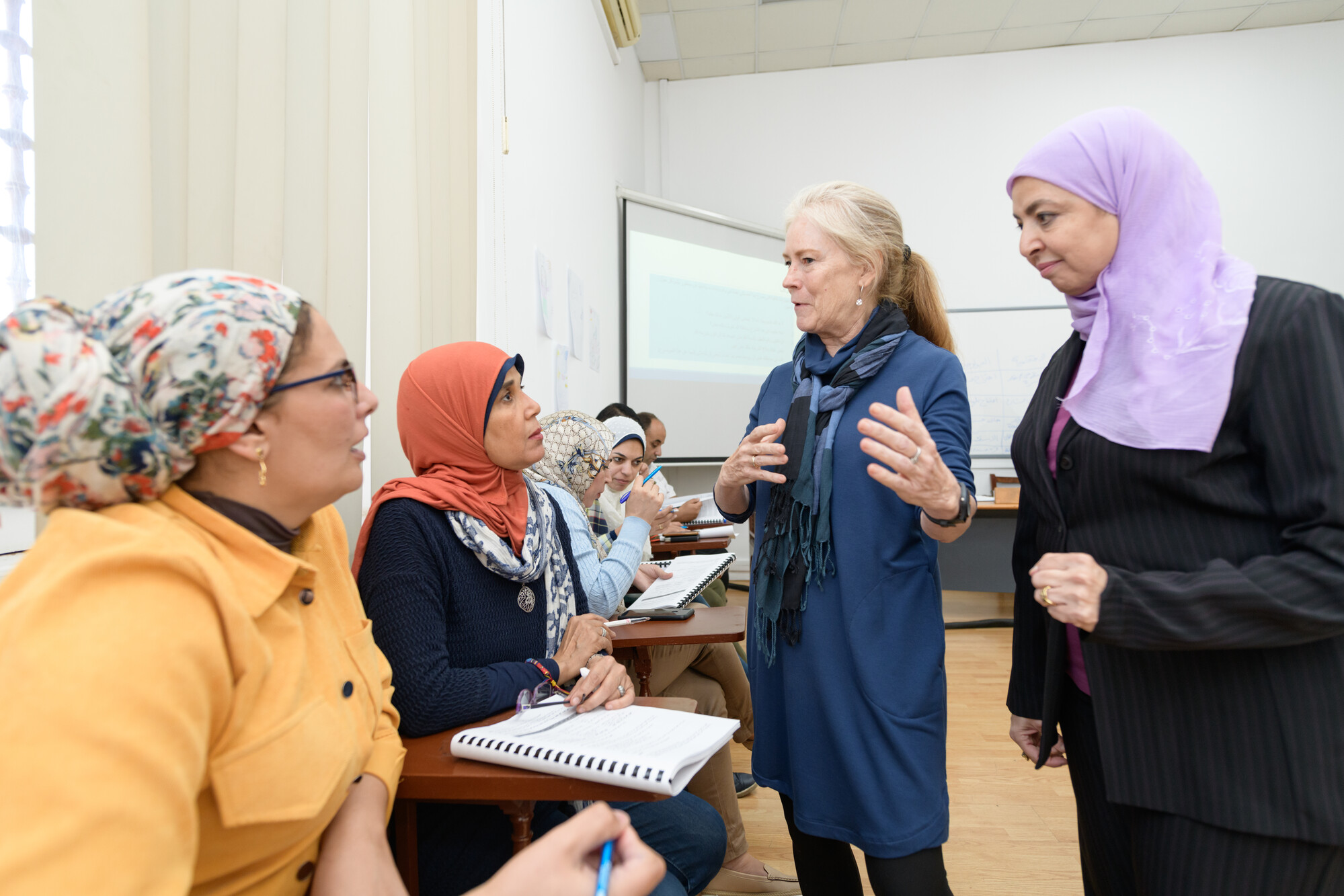 instructor explaining information to students in class