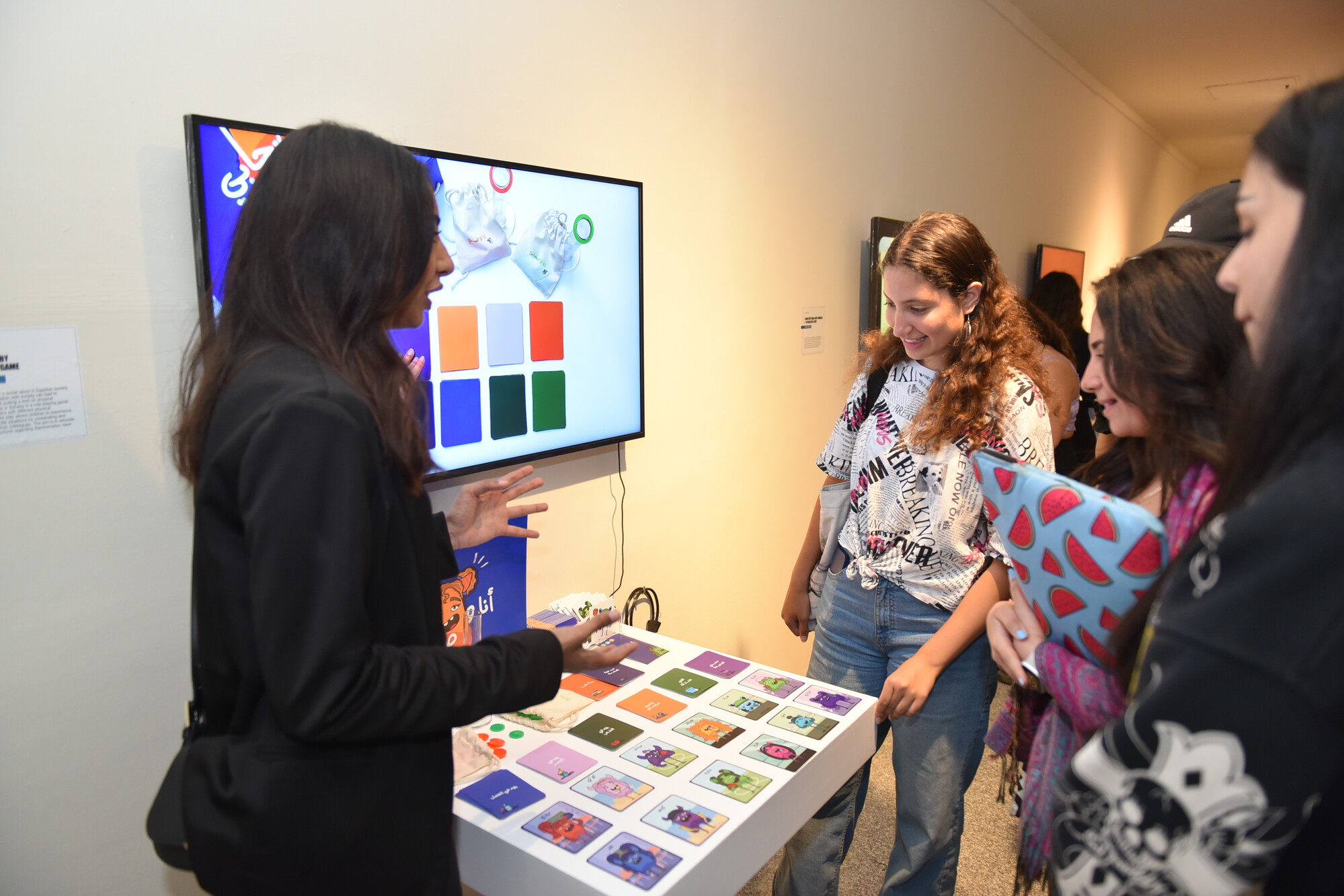 Female presenting products at booth