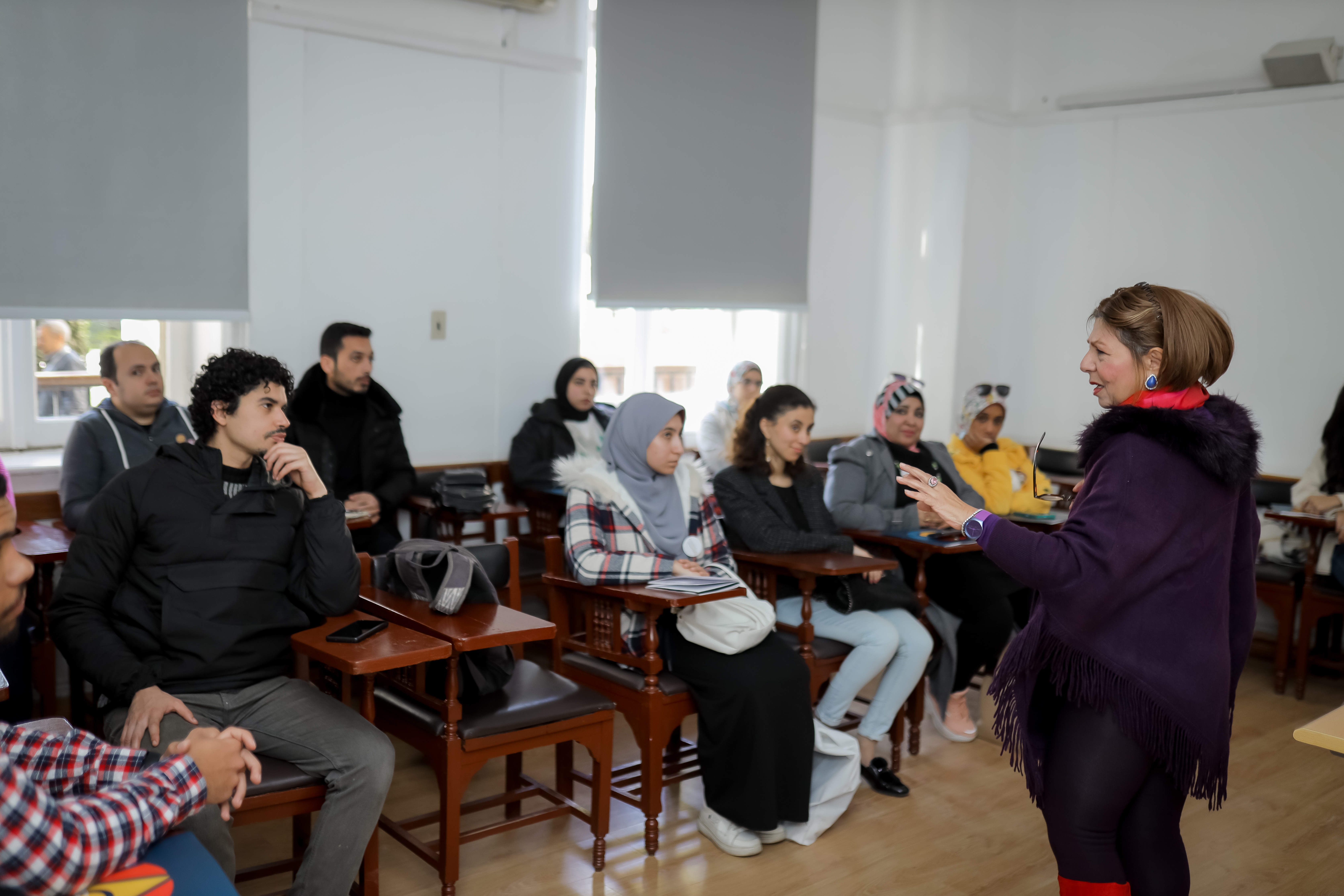 instructor explaining to students in a class