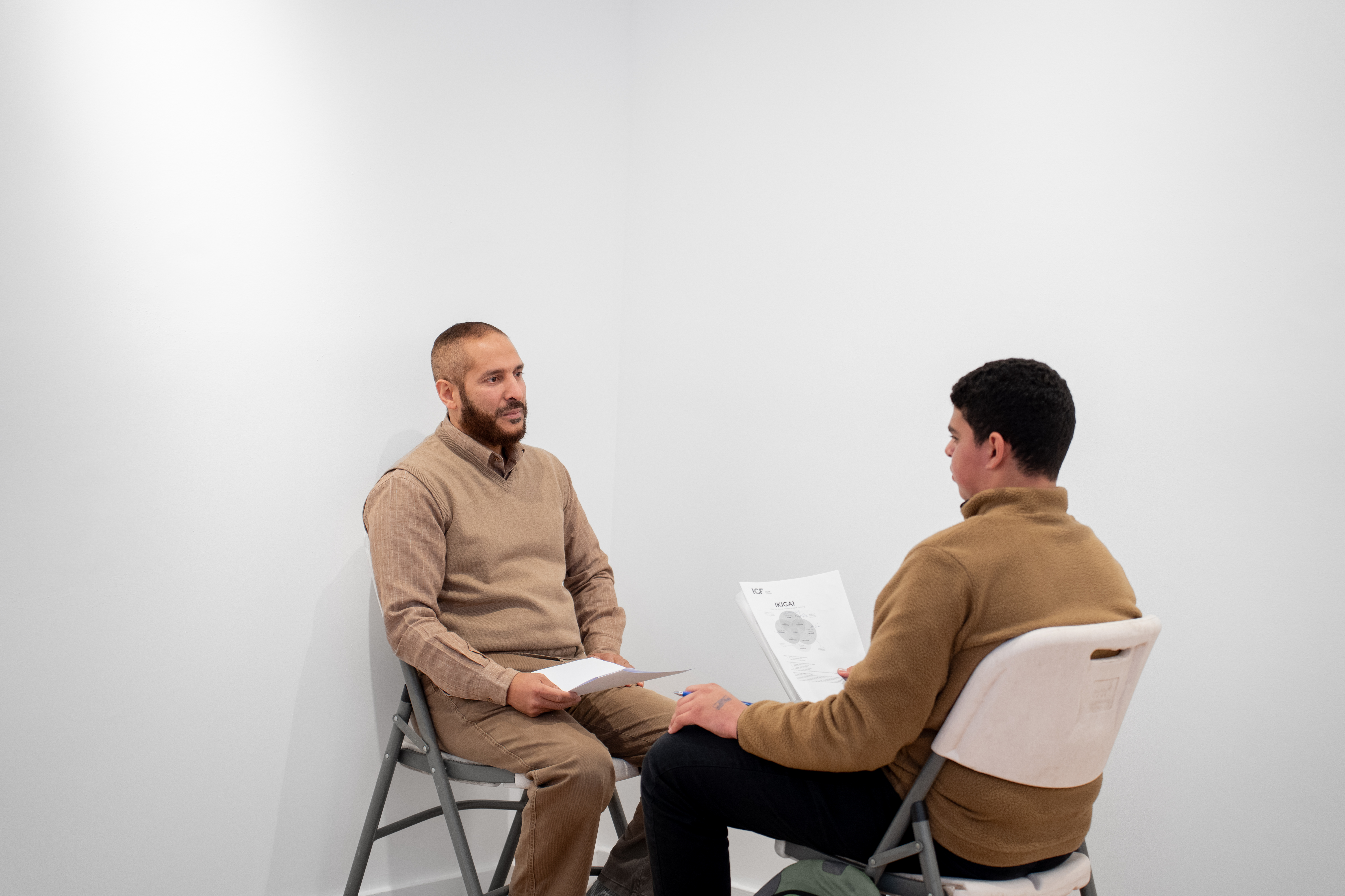 two male students making a conversation 