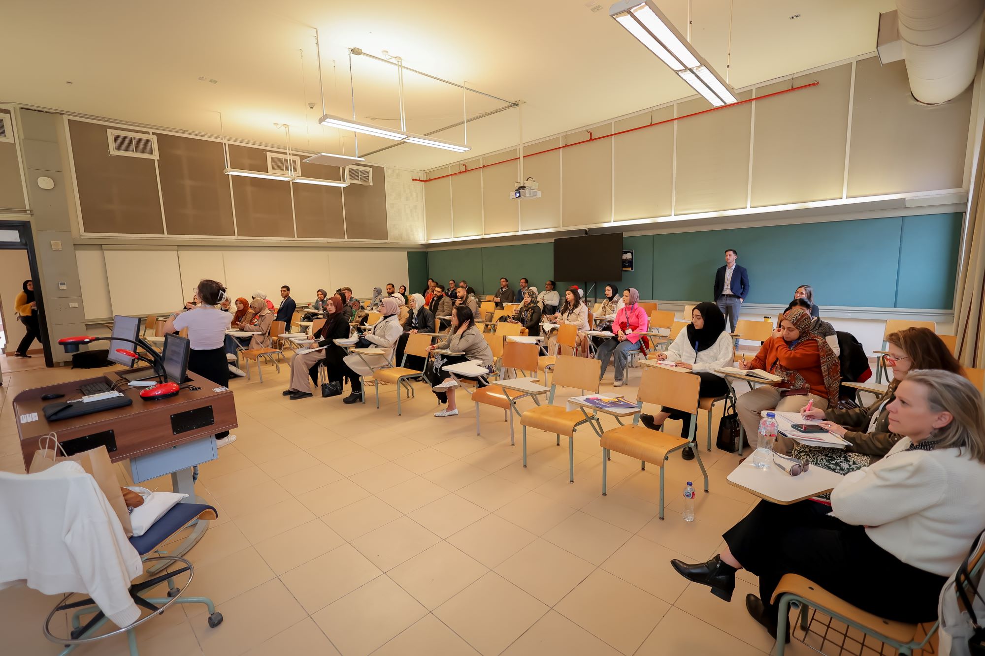 instructor explaining to students in a class