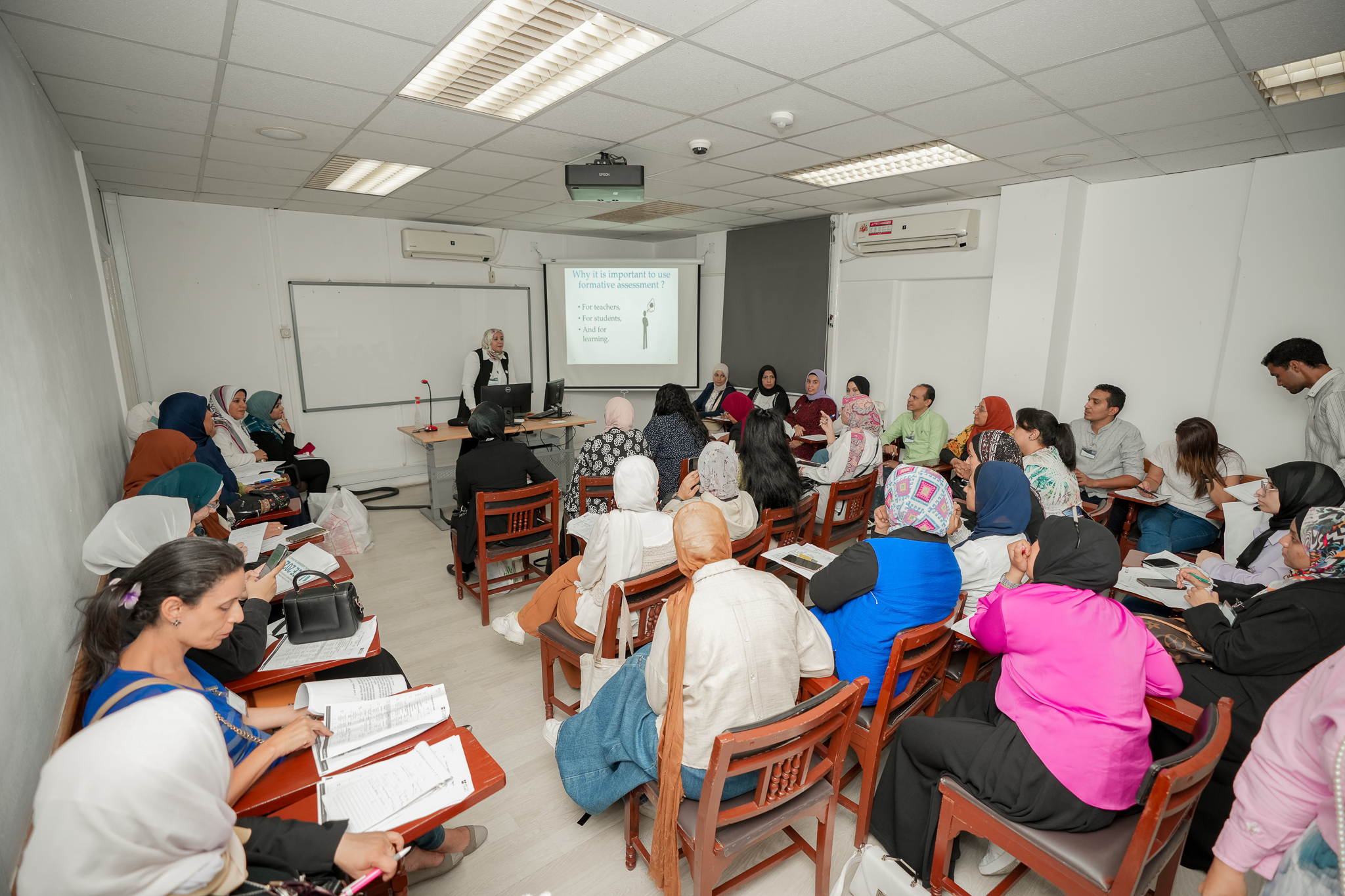 instructor explaining to students in a class