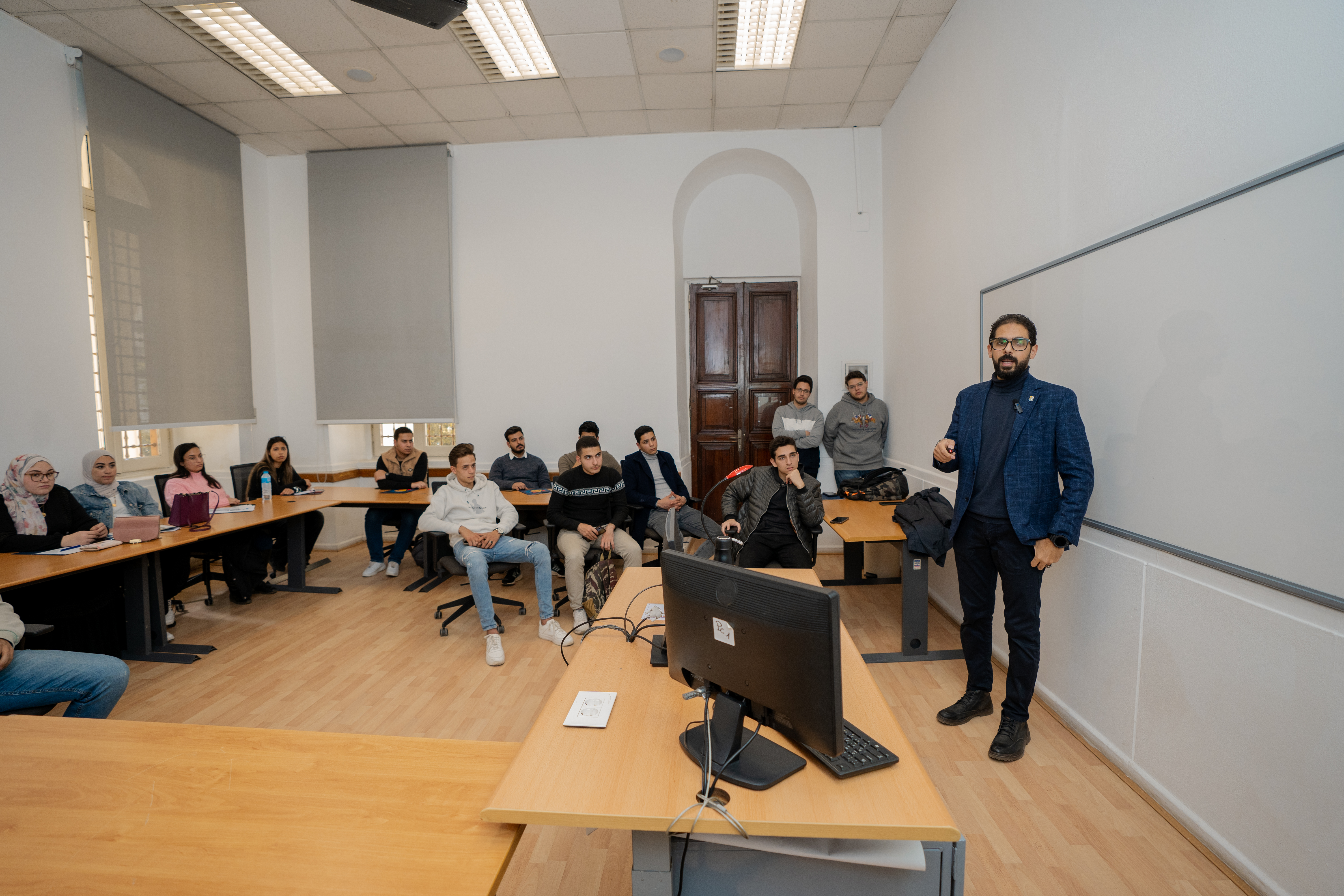 instructor explaining to students in a class