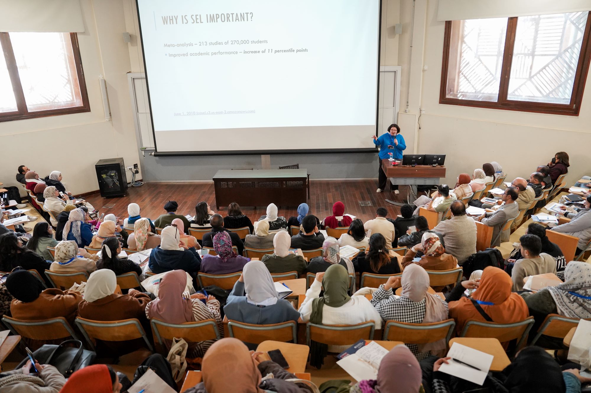 instructor explaining to students in a class about Banking Operations course at AUC's SCE