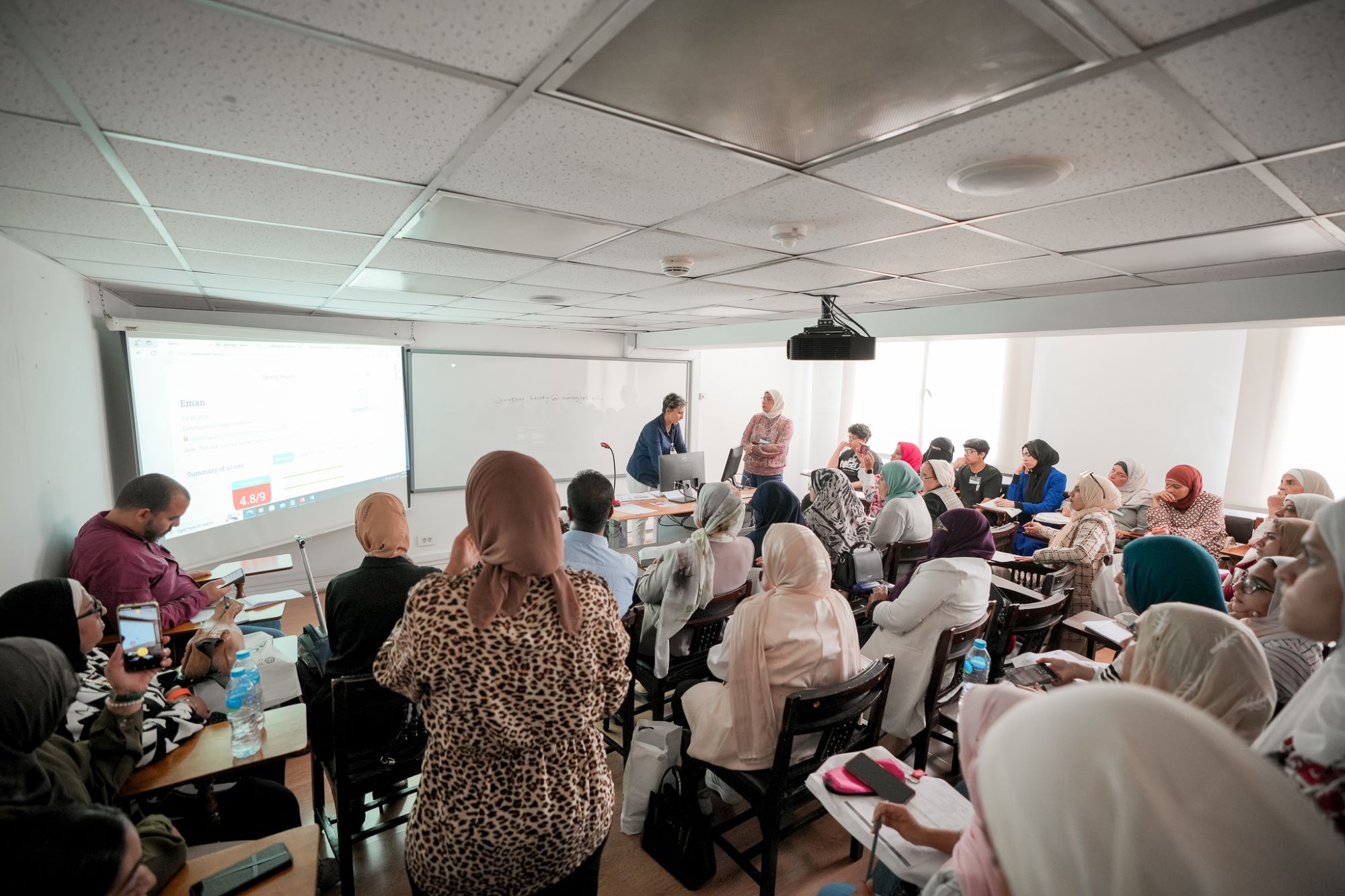 instructor explaining to students in a class about Business Finance at AUC's SCE