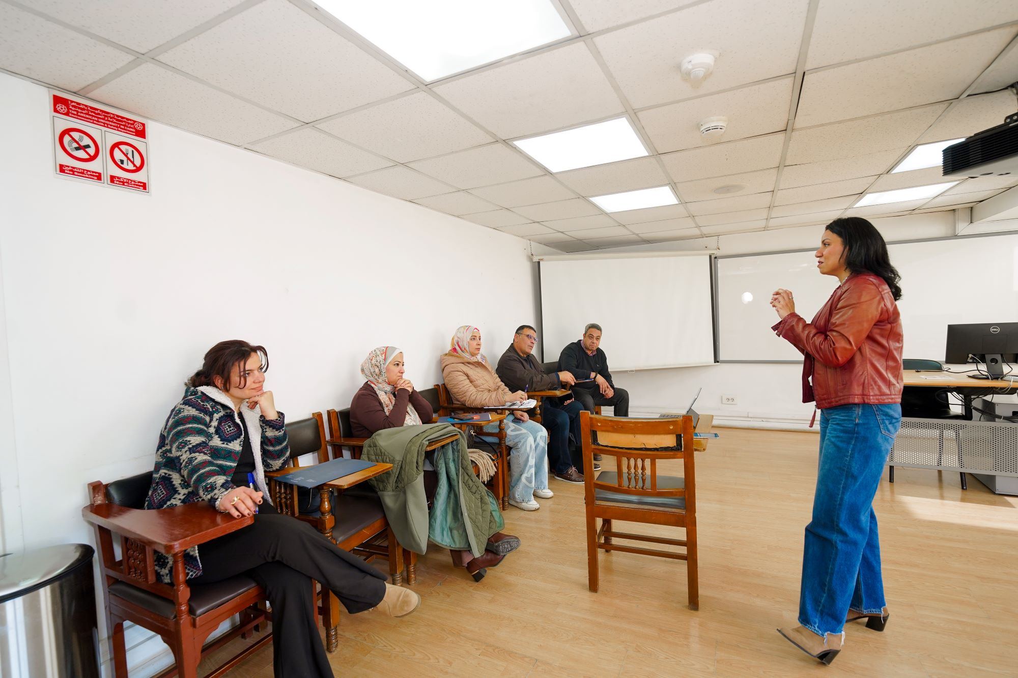 instructor explaining to students in a class about Compensation and Benefits Management stand alone course 