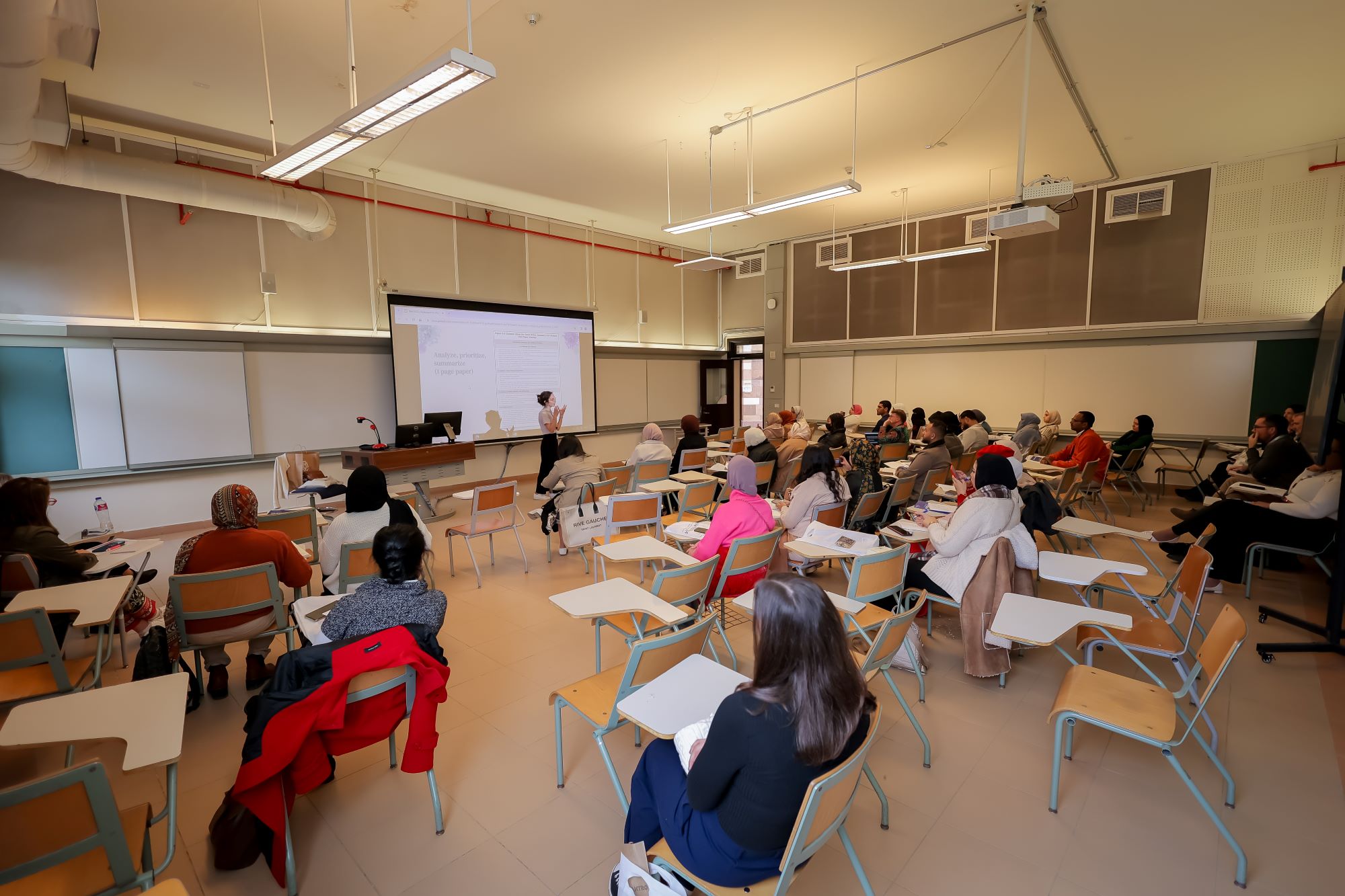 instructor explaining to students in a class