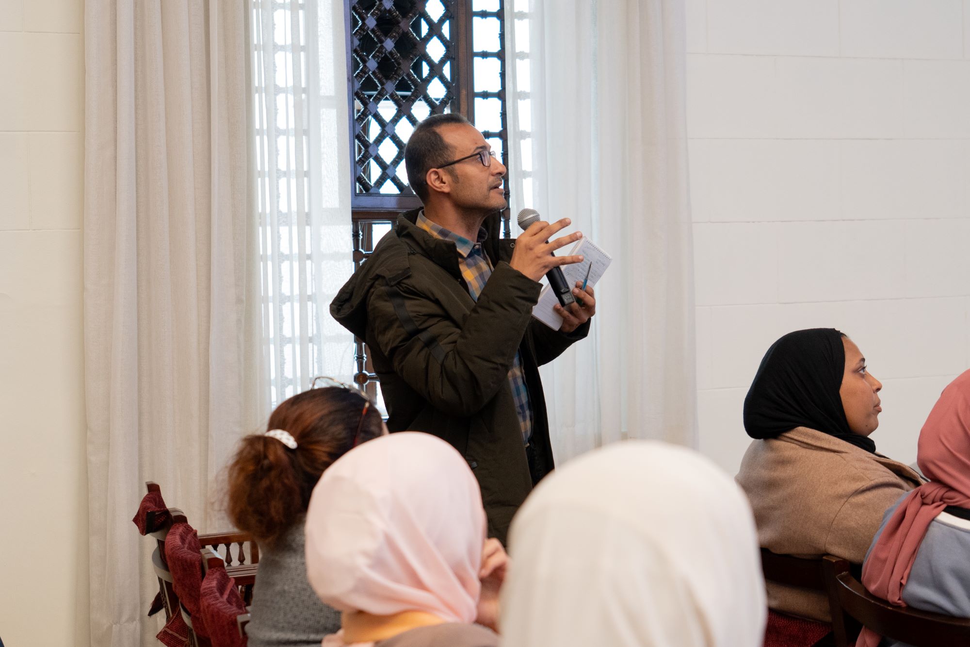 instructor explaining to students in a class