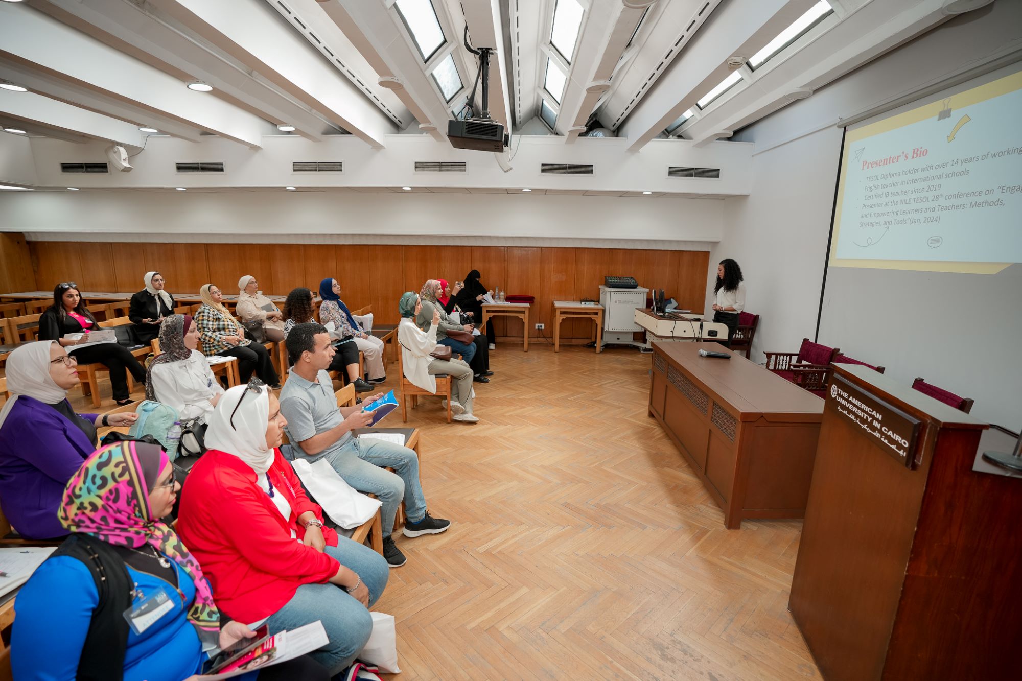 instructor explaining to students in a class about Managerial Economics course at AUC's SCE