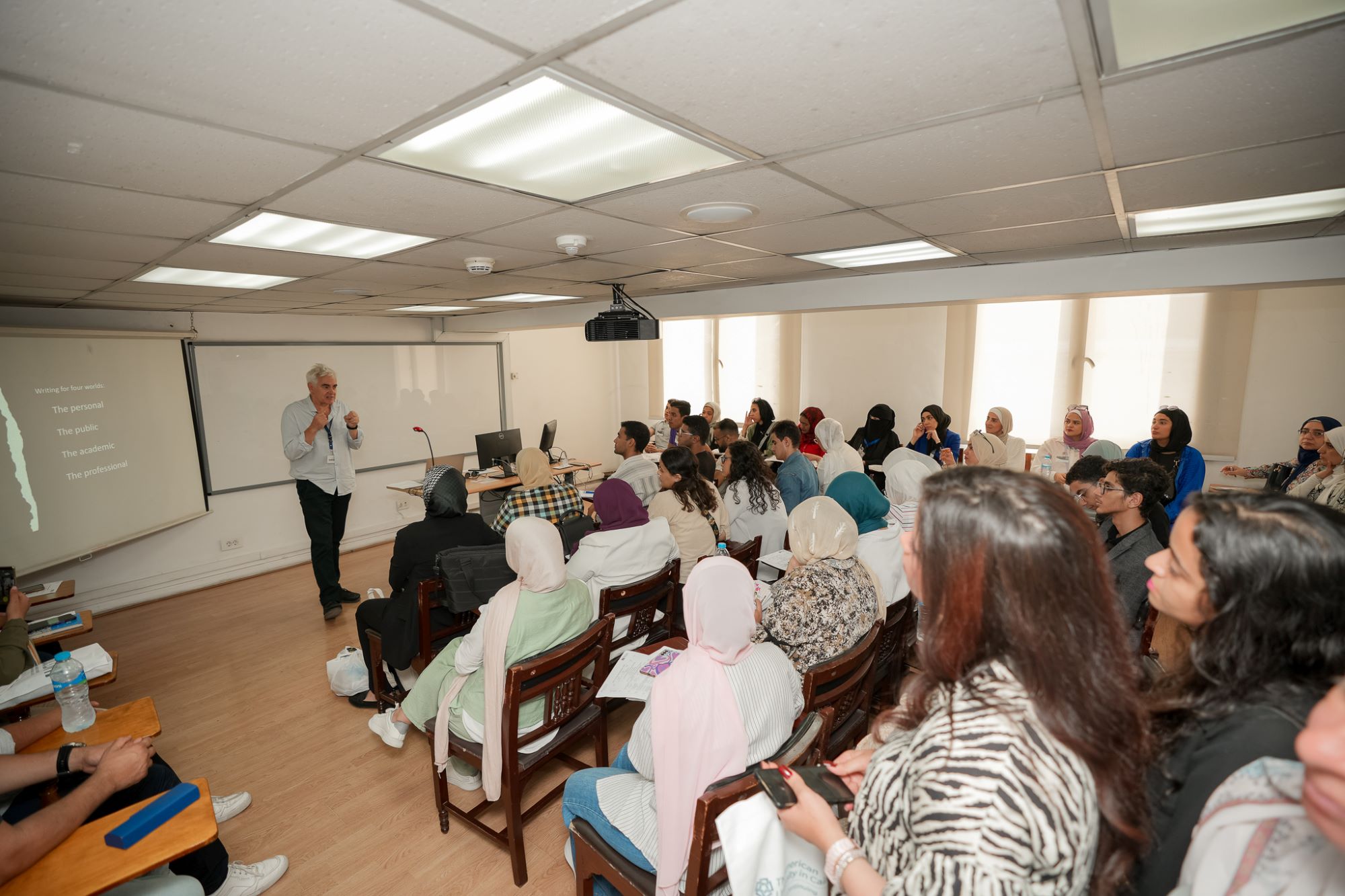 Students in the class with their instructor explaining AUC marketing course