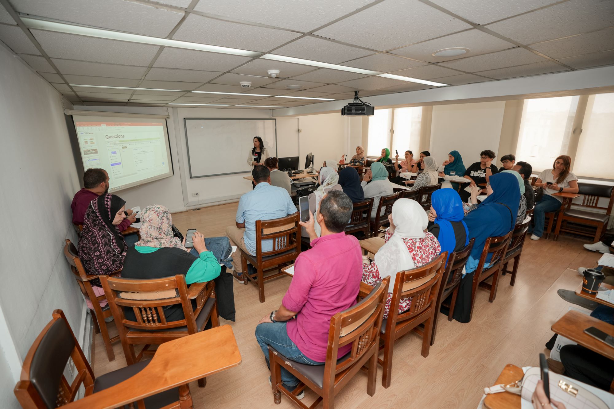 instructor explaining to students in a class