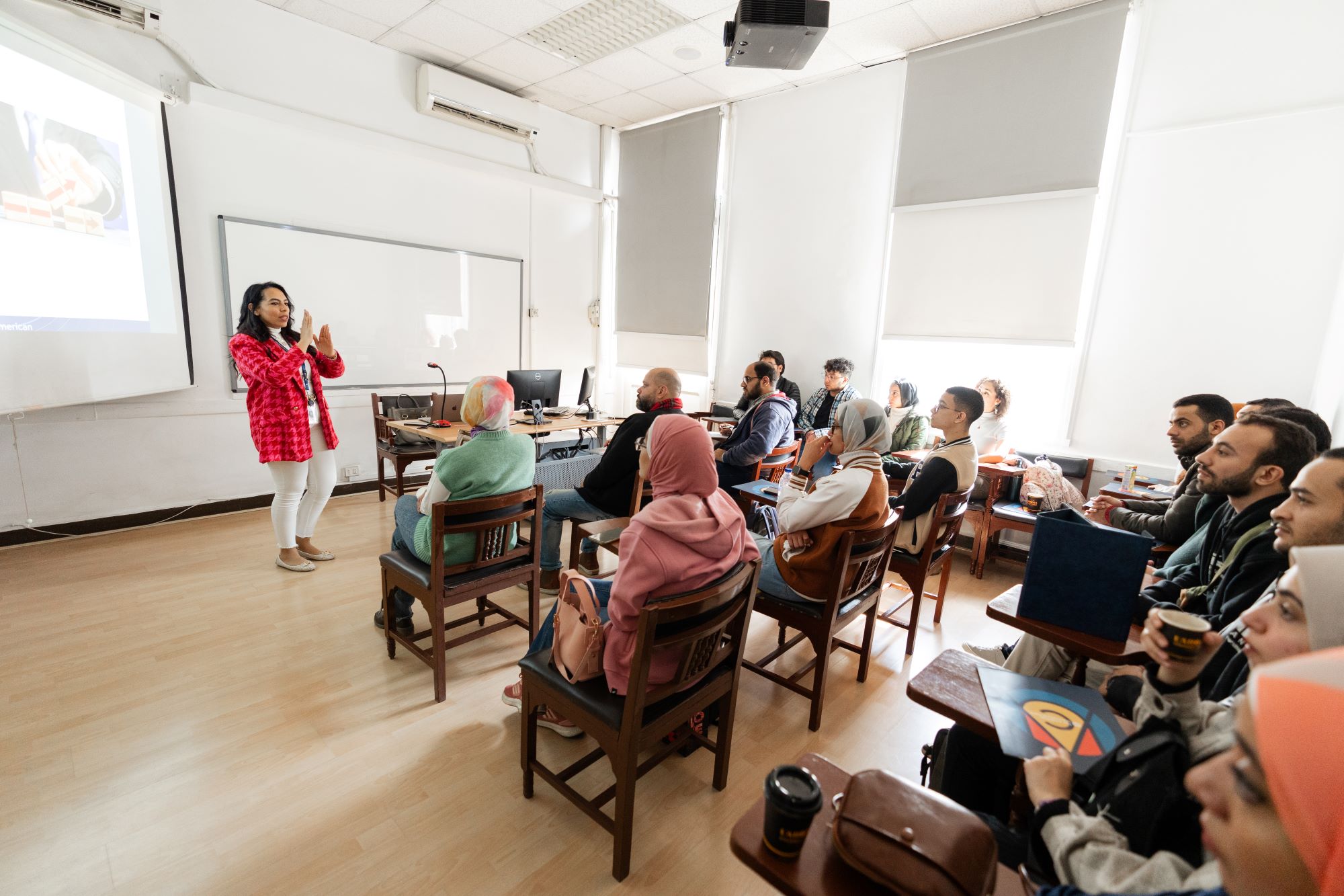 instructor explaining to students in a class