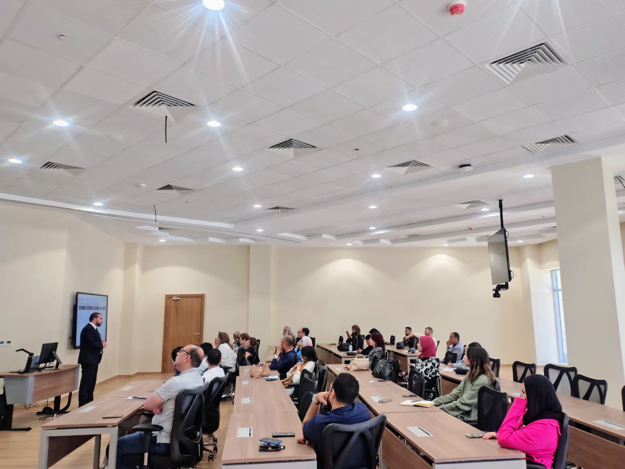 instructor explaining to students in a class in SCE Building in New Capital