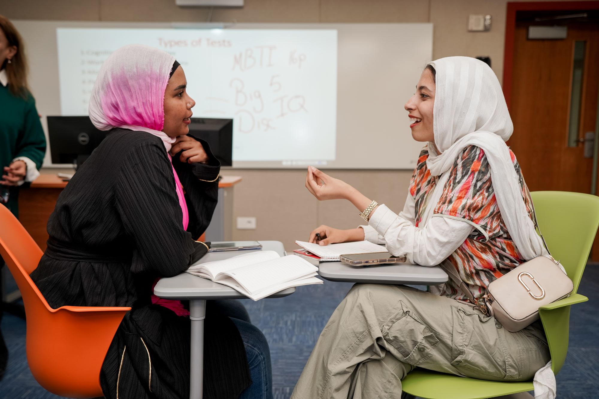 Students in the class discussing the course with each other 