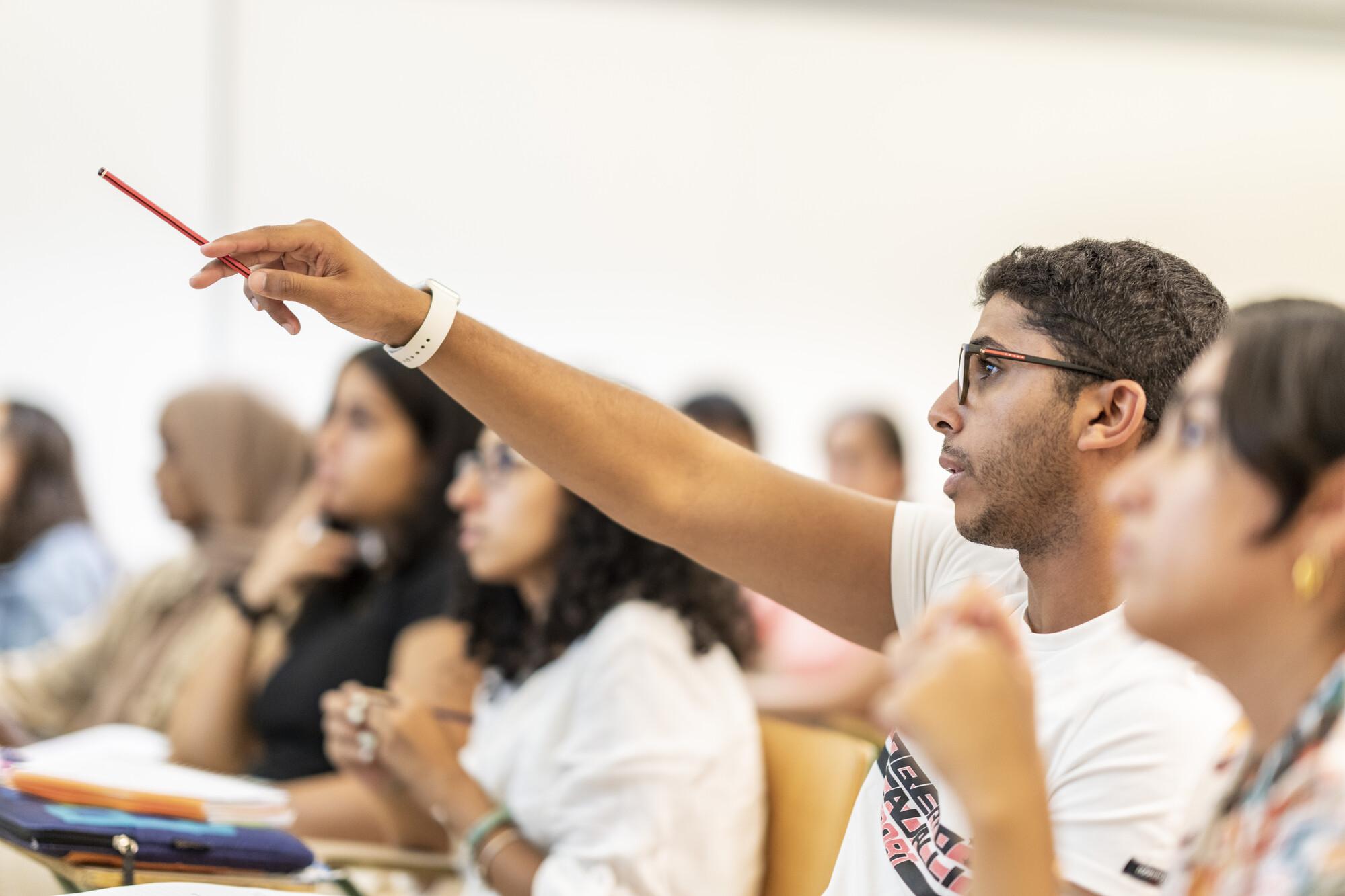students in class asking questions