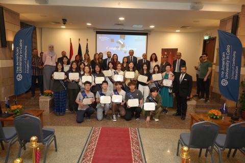 Hong Kong Metropolitan University students taking a group photo in P071 to celebrate their graduation and their visit to Egypt
