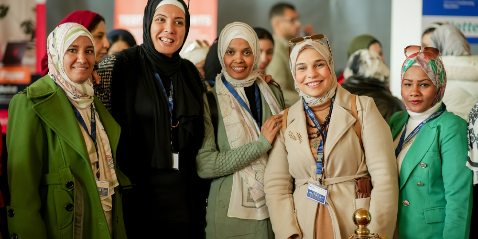 group of female teachers attending NileTESOL conference with conference tags