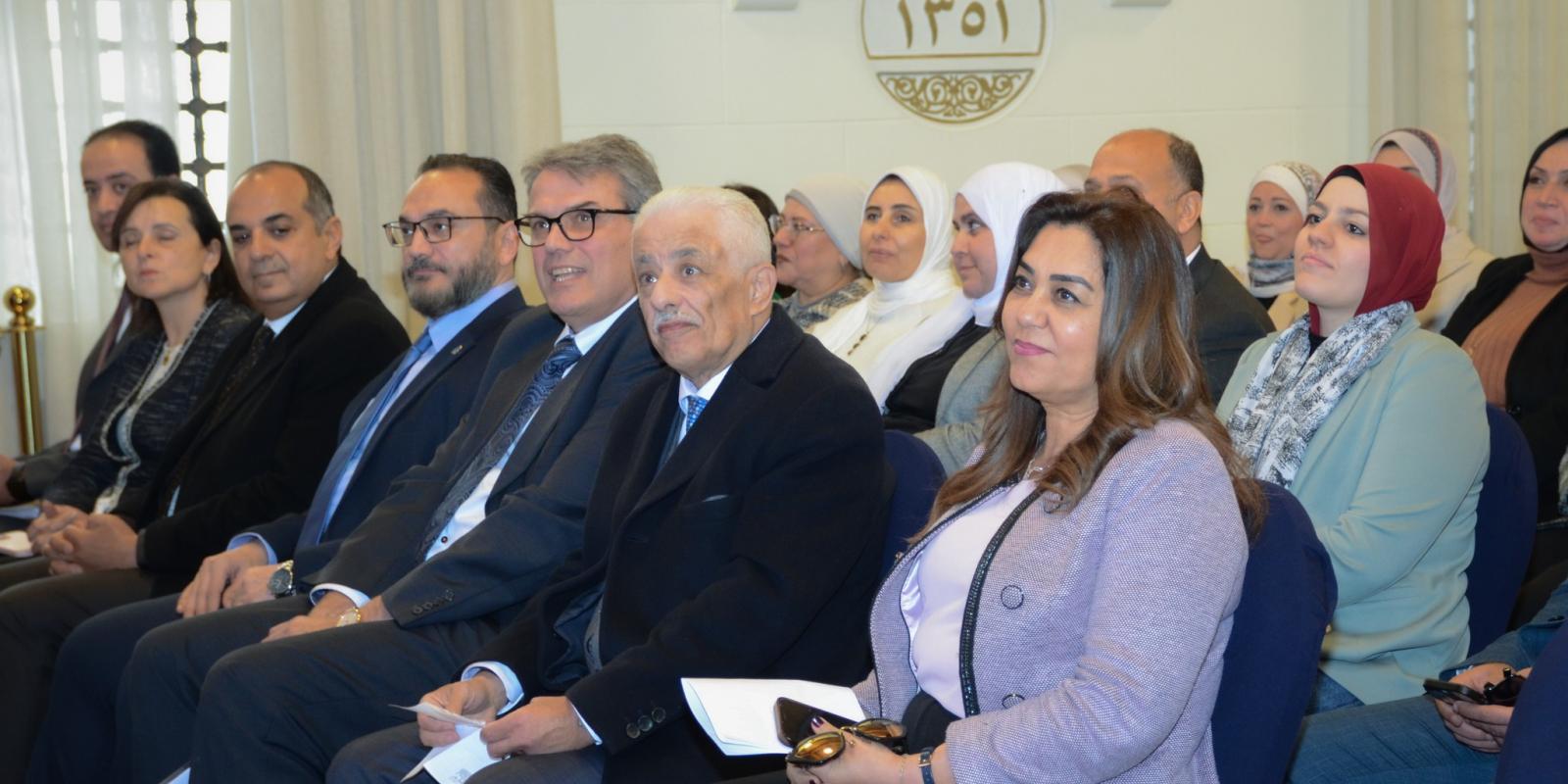 Dr. Manal Awad, Minister of Local Development, in attendance, Dr, Tarek Shawki, University Counselor, and Dr. Mahmoud Allam, Dean, AUC's School of Continuing Education