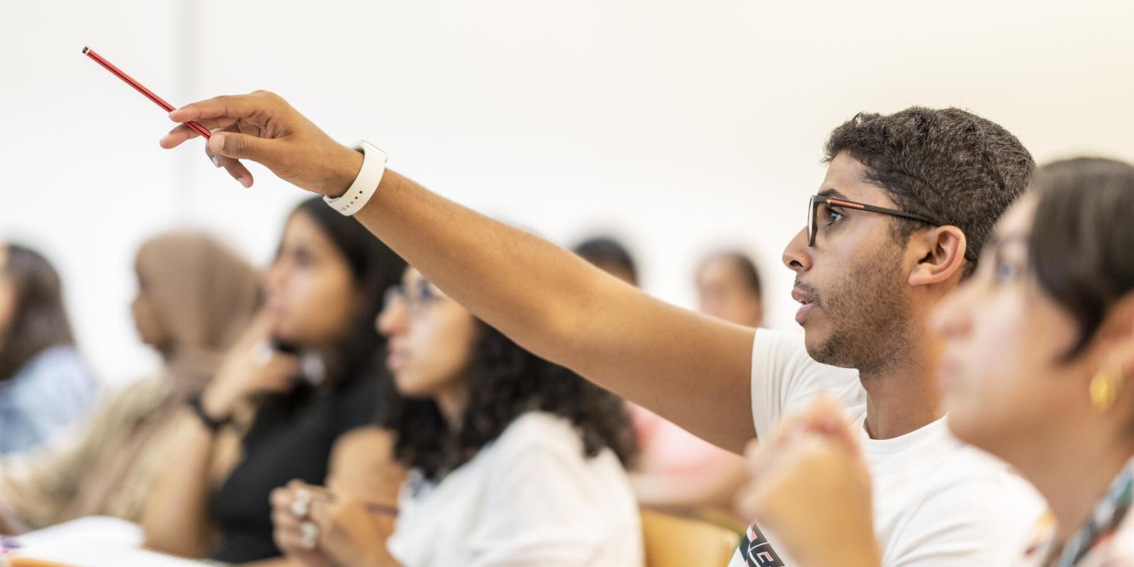 students in class asking questions