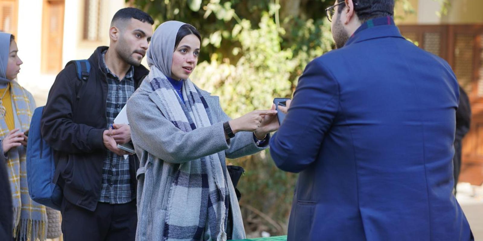 Student is asking for information during SCE event