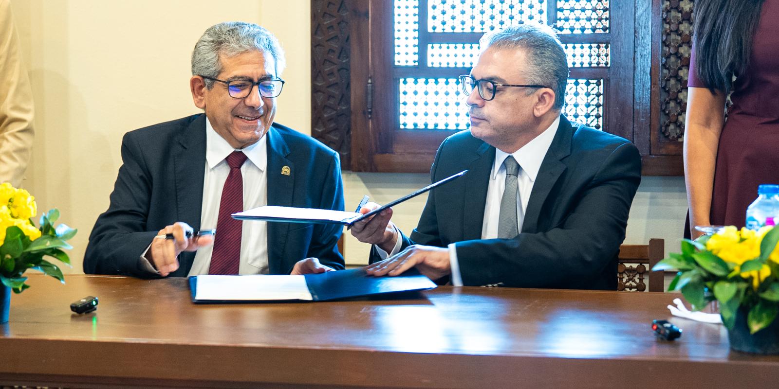 SCE Dean and Ain Shams University Dean signing a coloration contract  