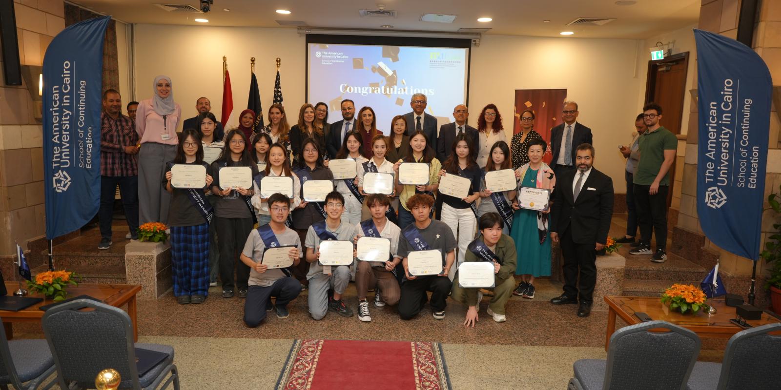 Hong Kong Metropolitan University students taking a group photo in P071 to celebrate their graduation and their visit to Egypt