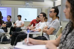 students focusing in class and listening to instructor