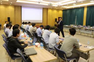 instructor explaining to students in a class