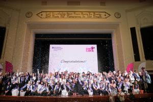 AUC_SCE's She Can program graduates celebrating their graduation on the stage of Ewart Hall