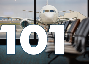A plane in an airport. Text: 101