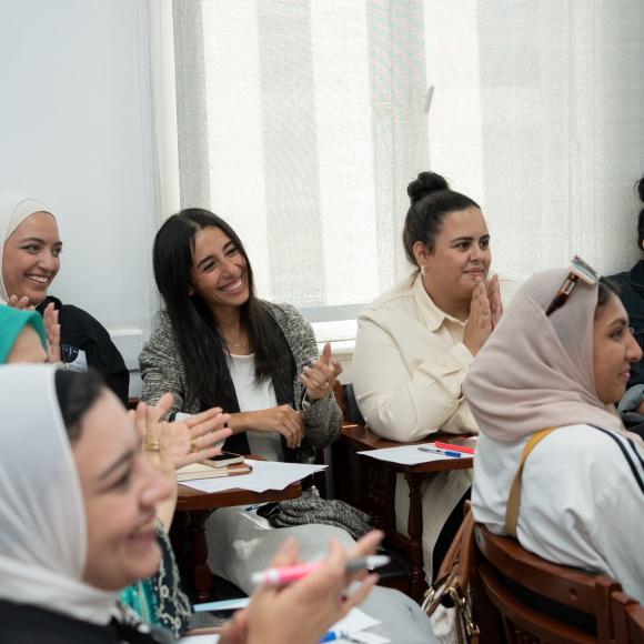 group of students smiling in class