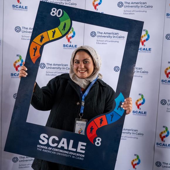 Attendee is taking a photo with SCALE frame 